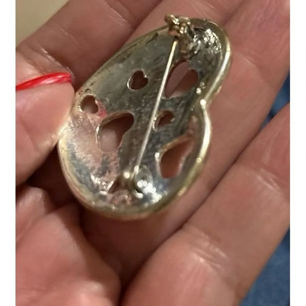 Vintage silver tone heart brooch with‎ cutout hearts